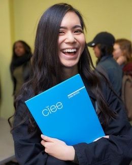 Student holding a CIEE folder